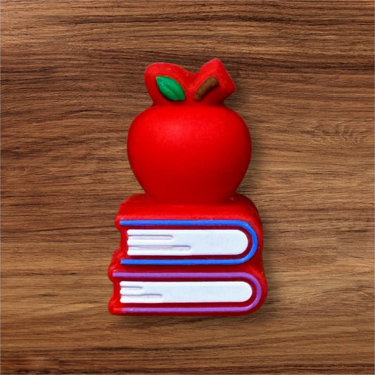 3-D Apple On Stacked Books Focal