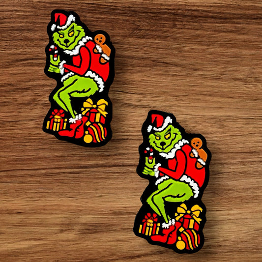 Green Guy Stealing Presents Focal